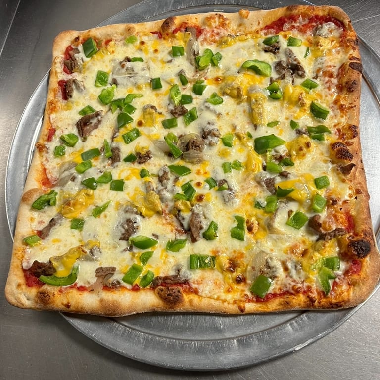 Indulge in Our Cheesesteak